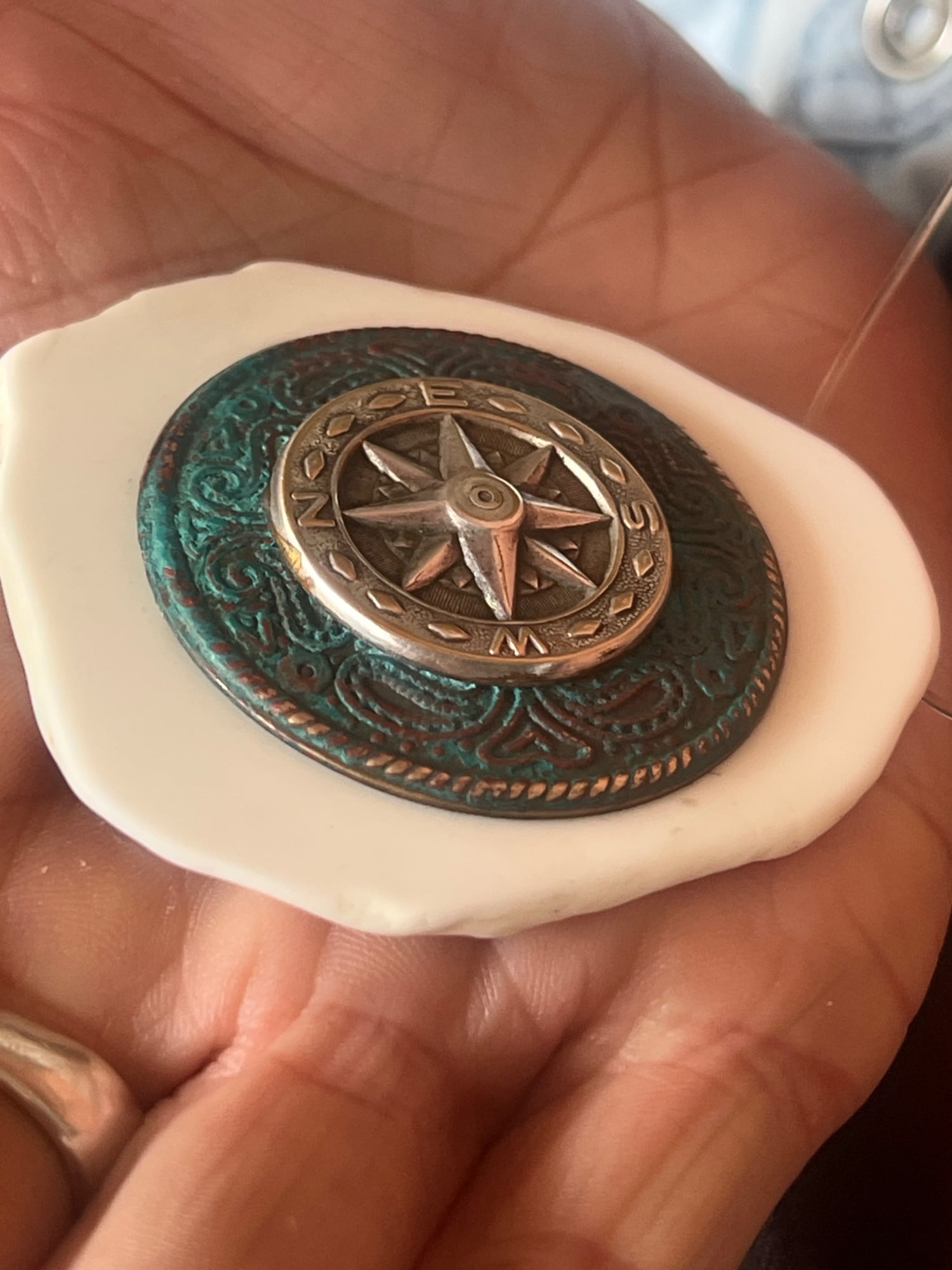 White howIite stone base with metal